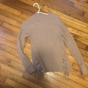 Tan turtleneck sweater with lace up detail